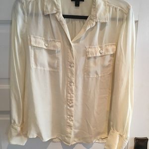 Cream colored women's long sleeved silk blouse